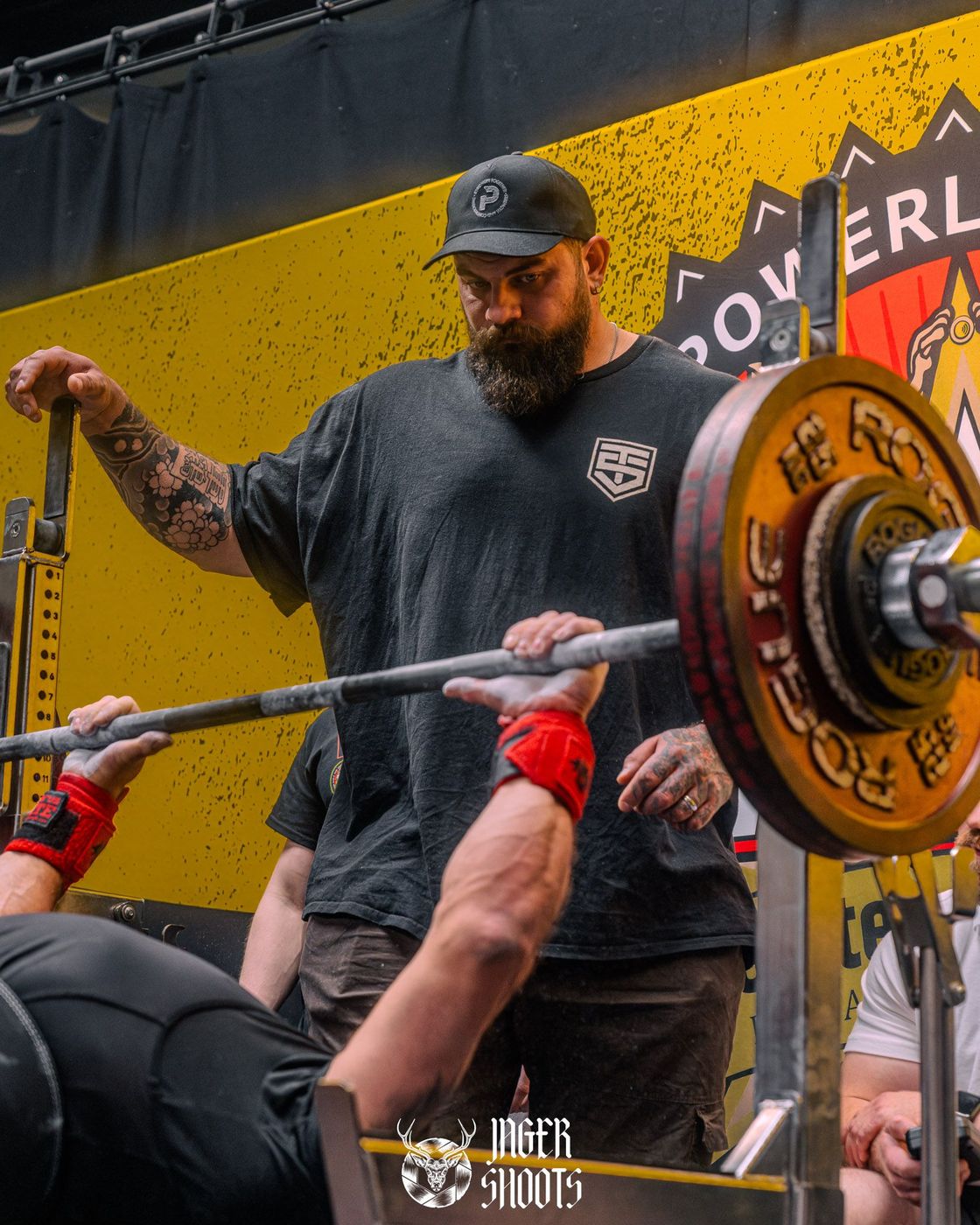 Ben coaching an athlete on the bench press